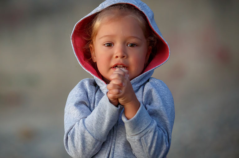 Girl picking her nose